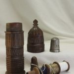Carved needle and thimble holder