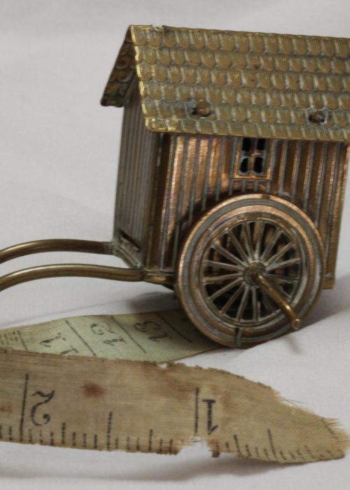Brass novelty tape measure in the form of a Victorian bathing box