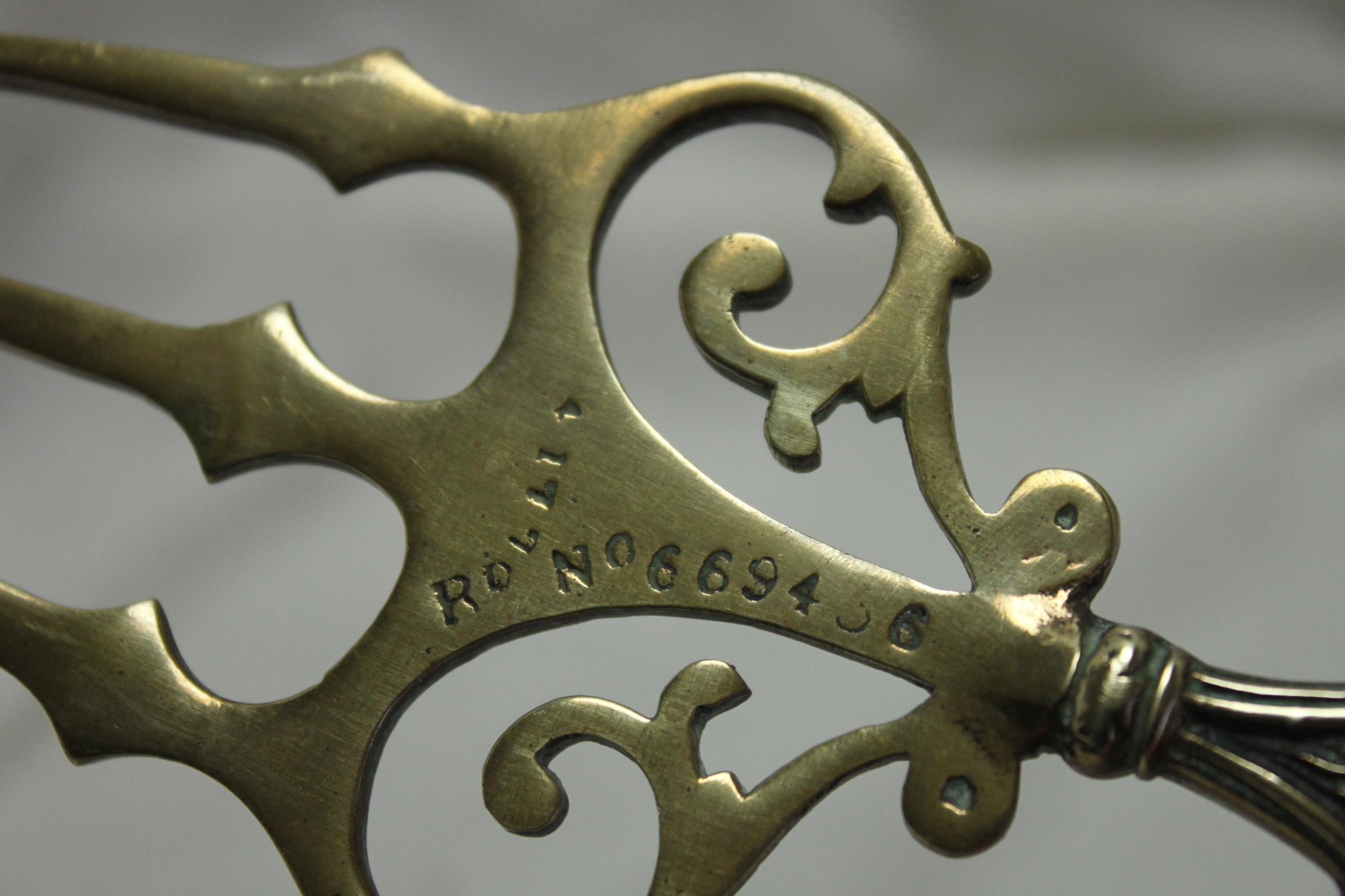 Brass toasting fork decorated with Lincoln Imp China Rose Antiques