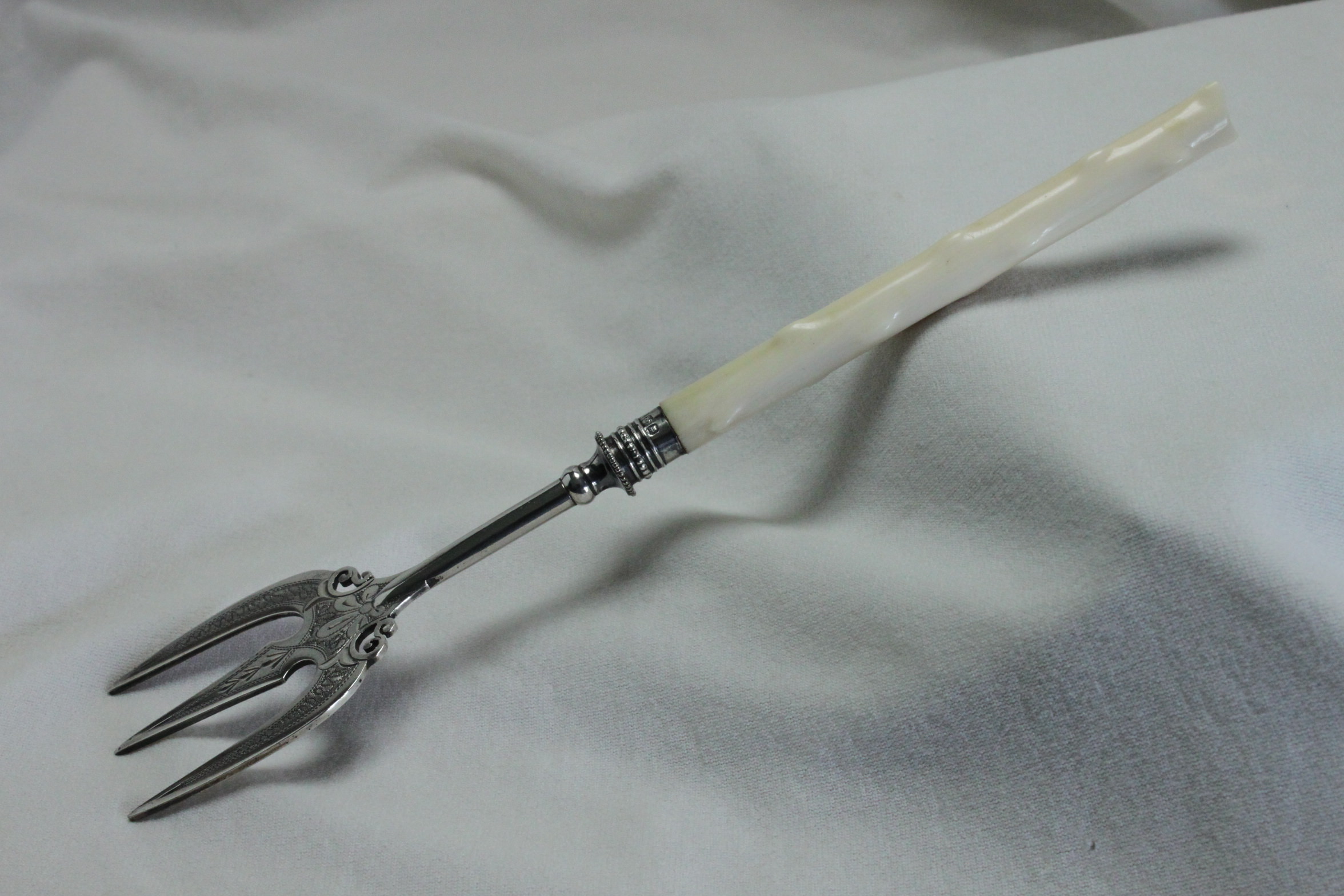 Engraved sterling silver bread fork with Ivorine handle Sheffield 1899